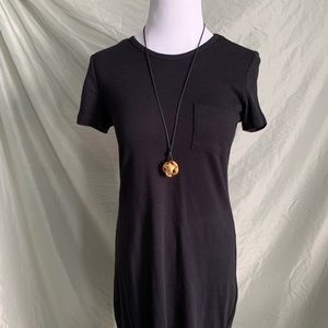 Gold pendant with black cord necklace